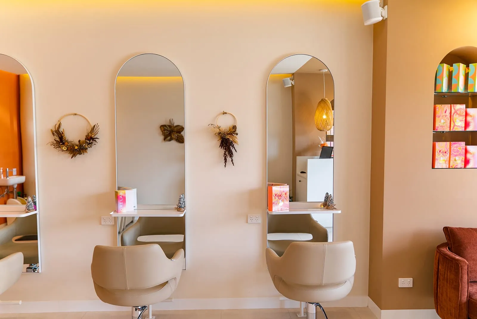 Arched mirrors at styling stations at Hair By Rena, Gregory Hills