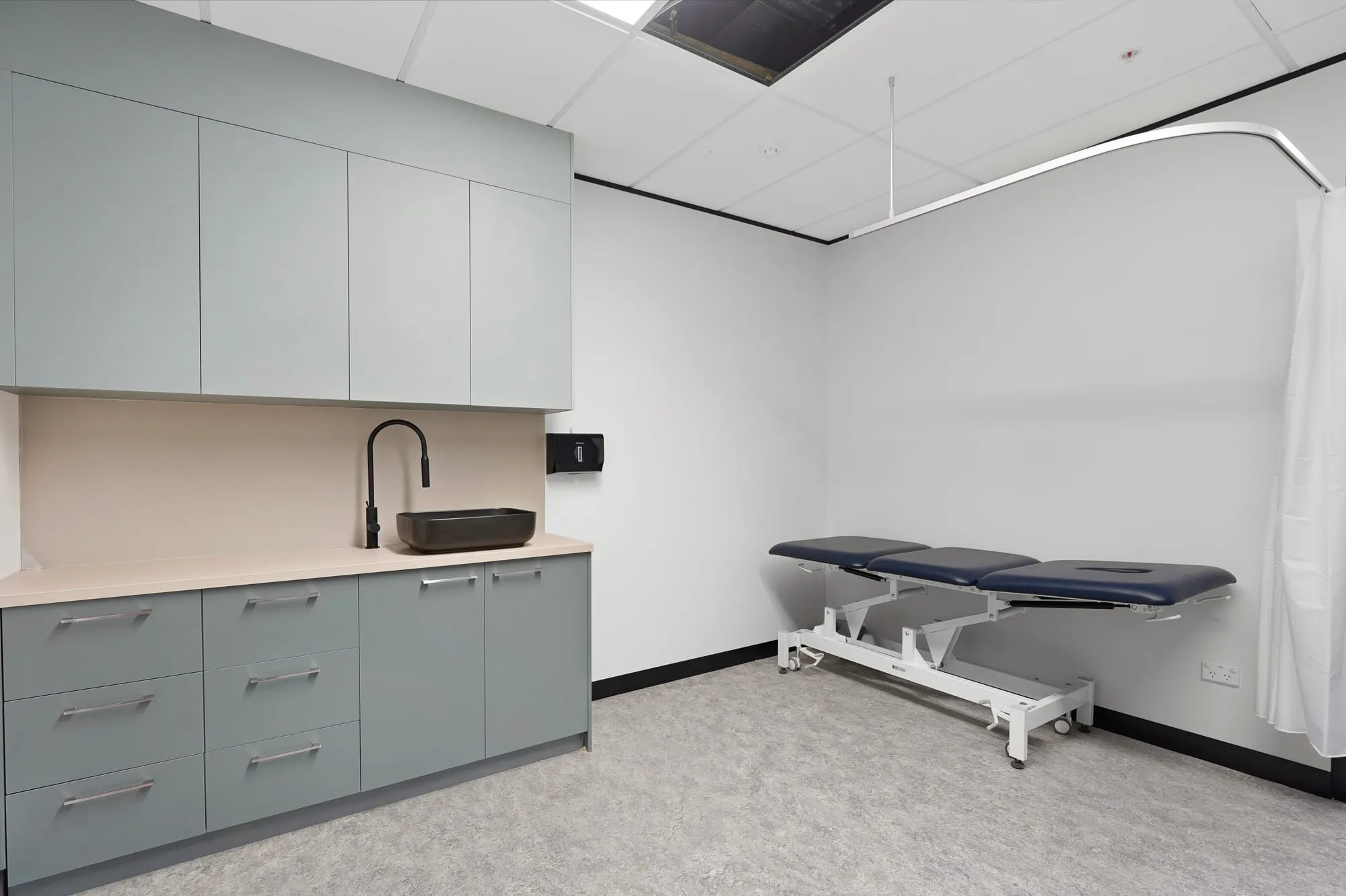 Treatment room with joinery and examination bed at headspace, Oran Park