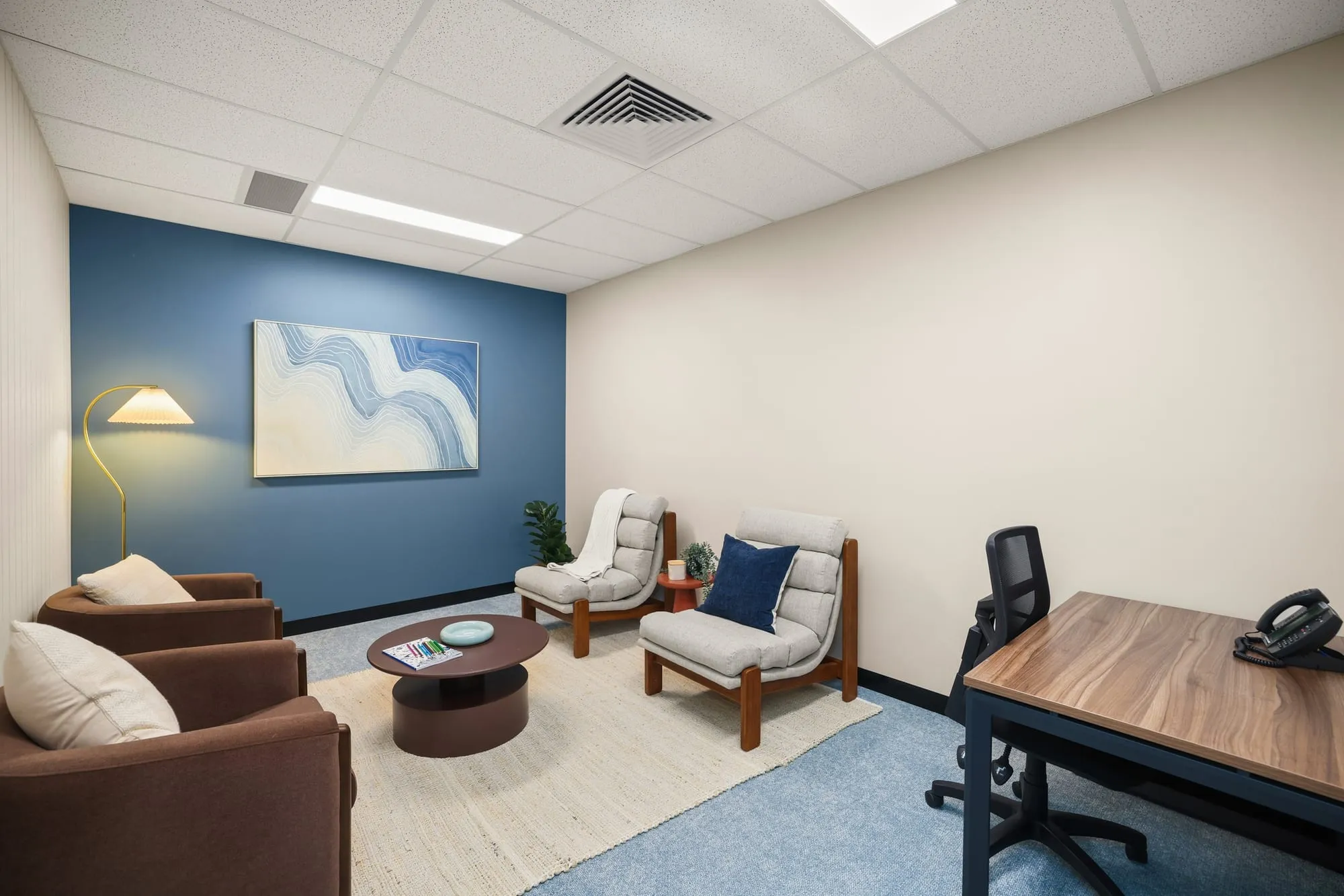 Counselling lounge with blue feature wall at HelpAhead, Caringbah