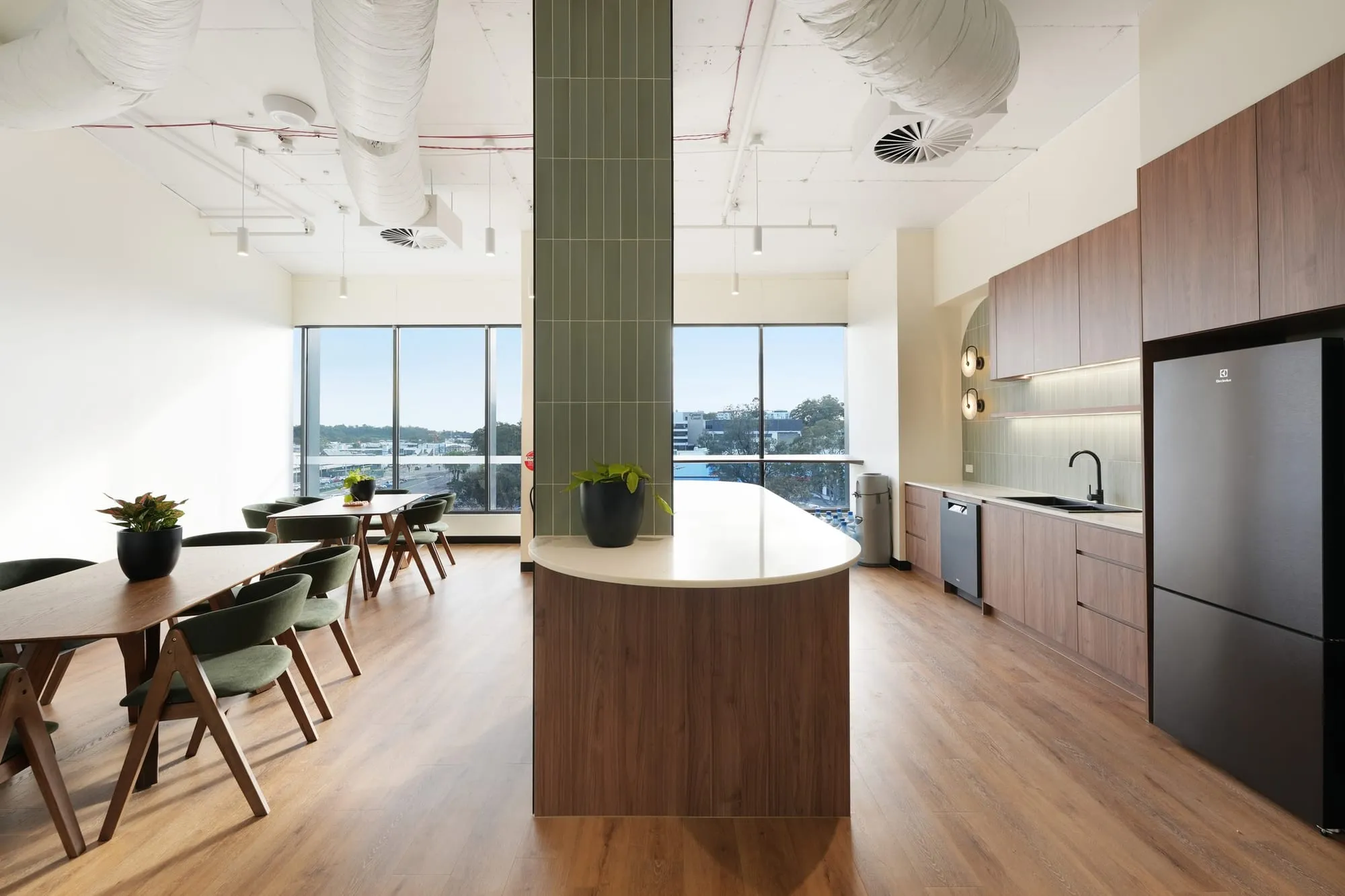 Breakout area with tiled column and timber joinery at Medicare Mental Health, Campbelltown